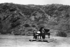 Two_women_performing_on_a_barn_door_in_the_first_known_musical_event_at_the_Hollywood_Bowl_ca.1920_CHS-14567-300x200.jpg