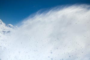 Freerider snowboarder moving down in snow powder